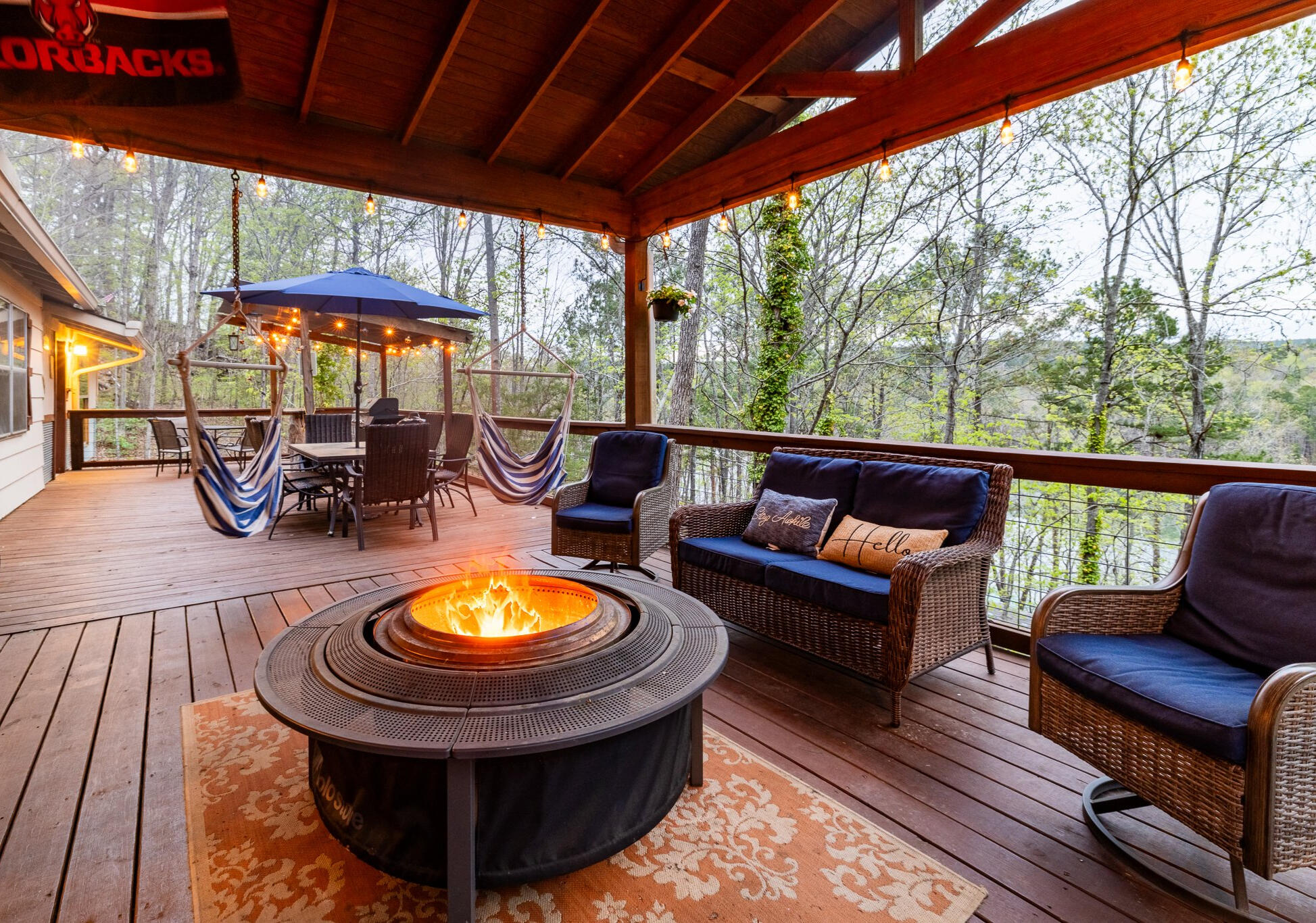 Evenings on the Deck As the sun sets, the deck becomes the heart of your stay—string lights overhead, firepit crackling, and plenty of space to gather, laugh, or just soak in the stillness of the trees.